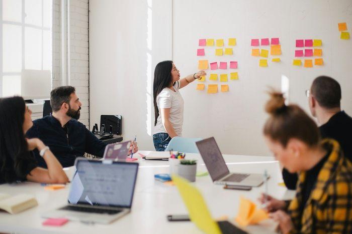 coworkers working in a meeting room